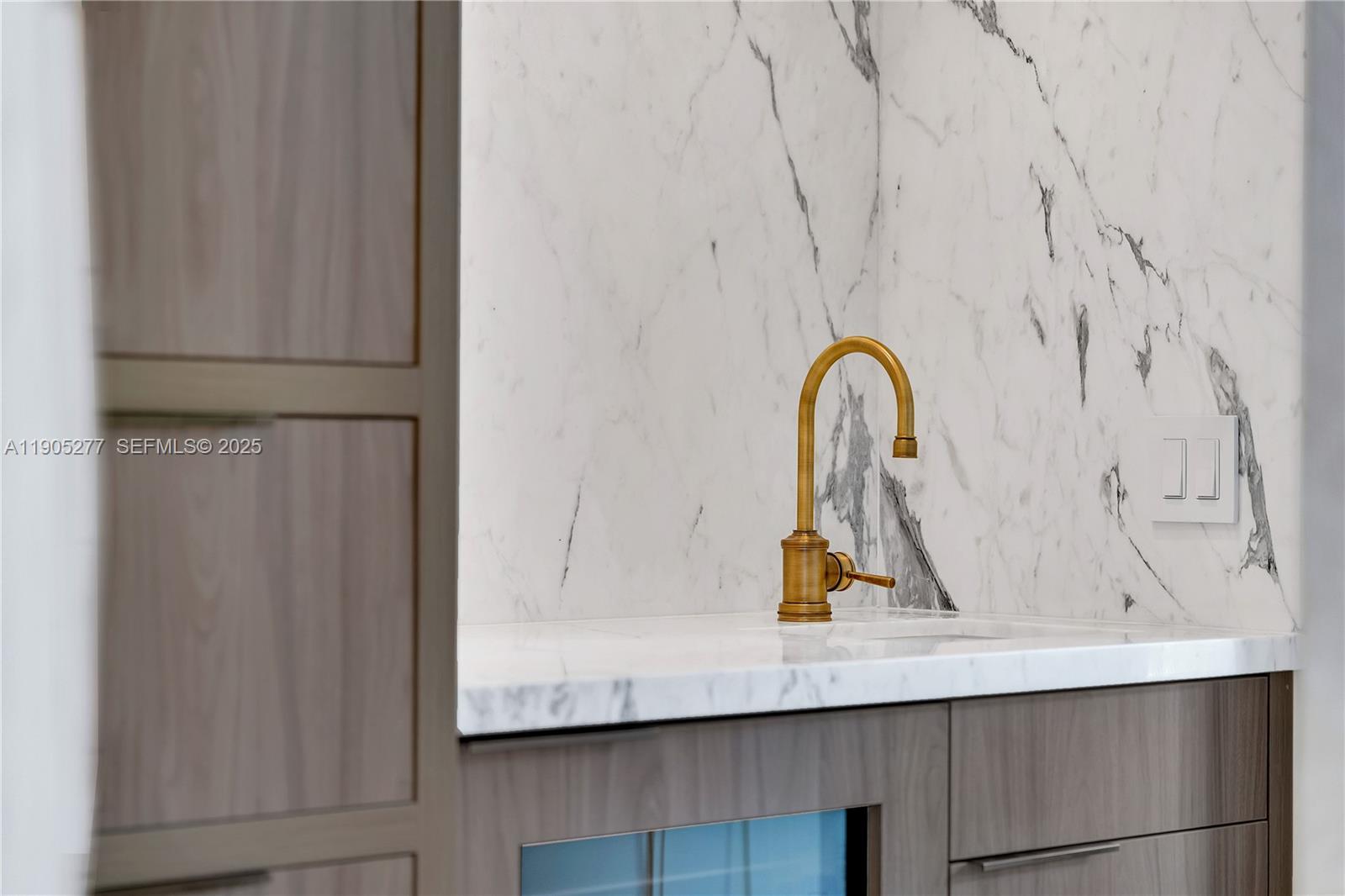 4191 Battersea Road Miami, FL 33133 - Photo 19 of 27 a bathroom with a granite countertop sink and a mirror