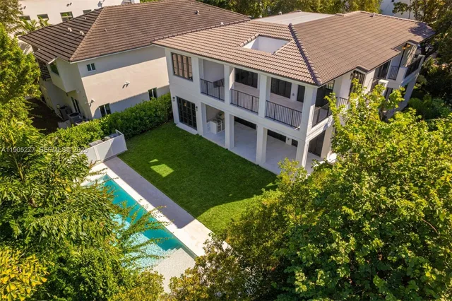 a aerial view of a house with a yard and plants