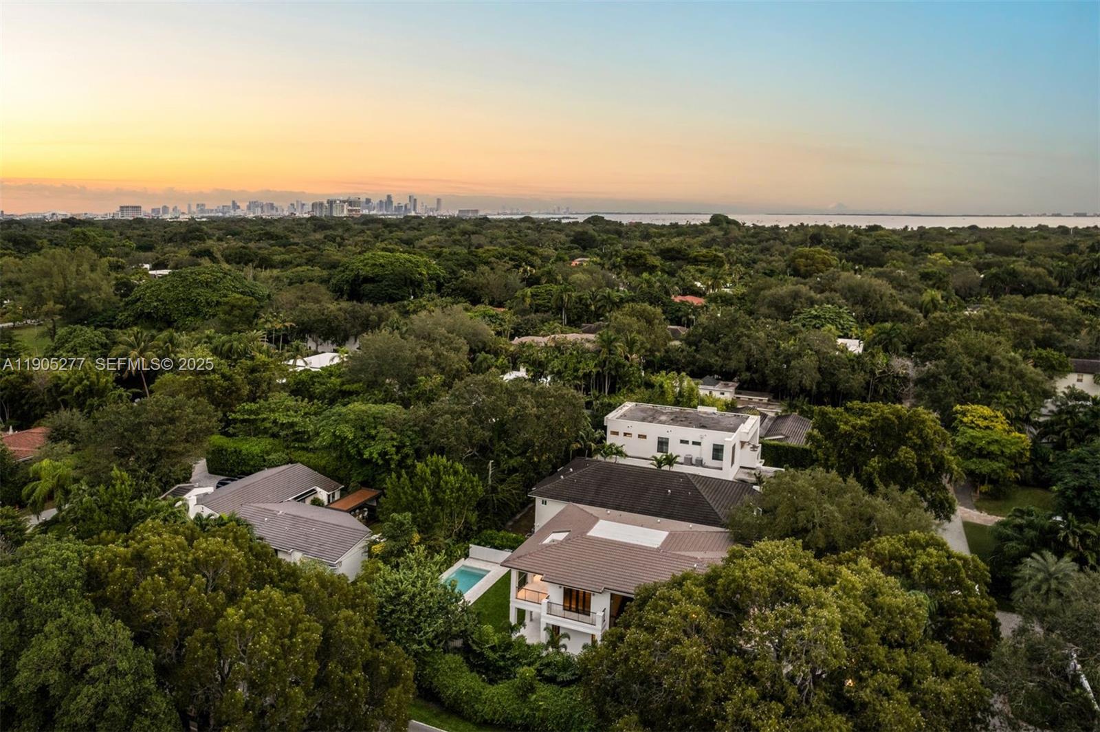 4191 Battersea Road Miami, FL 33133 - Photo 27 of 27 an aerial view of a house with a garden