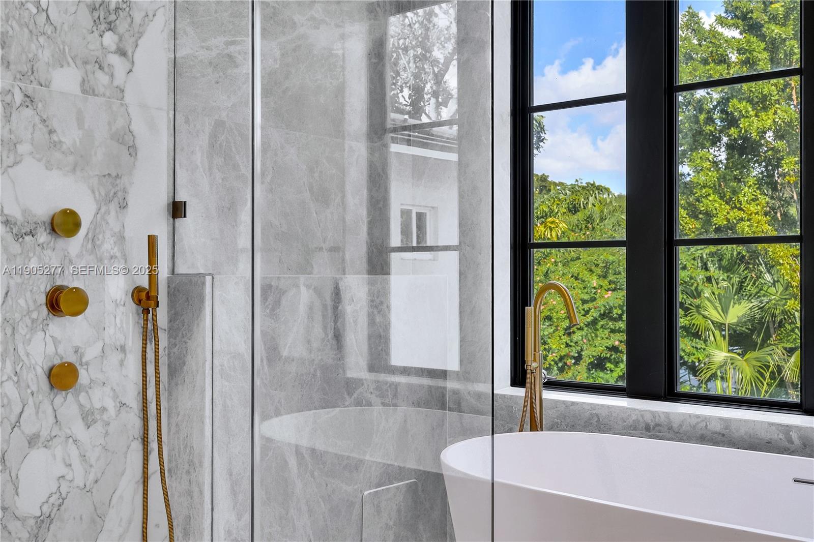 4191 Battersea Road Miami, FL 33133 - Photo 7 of 27 a bathroom with a bathtub and shower