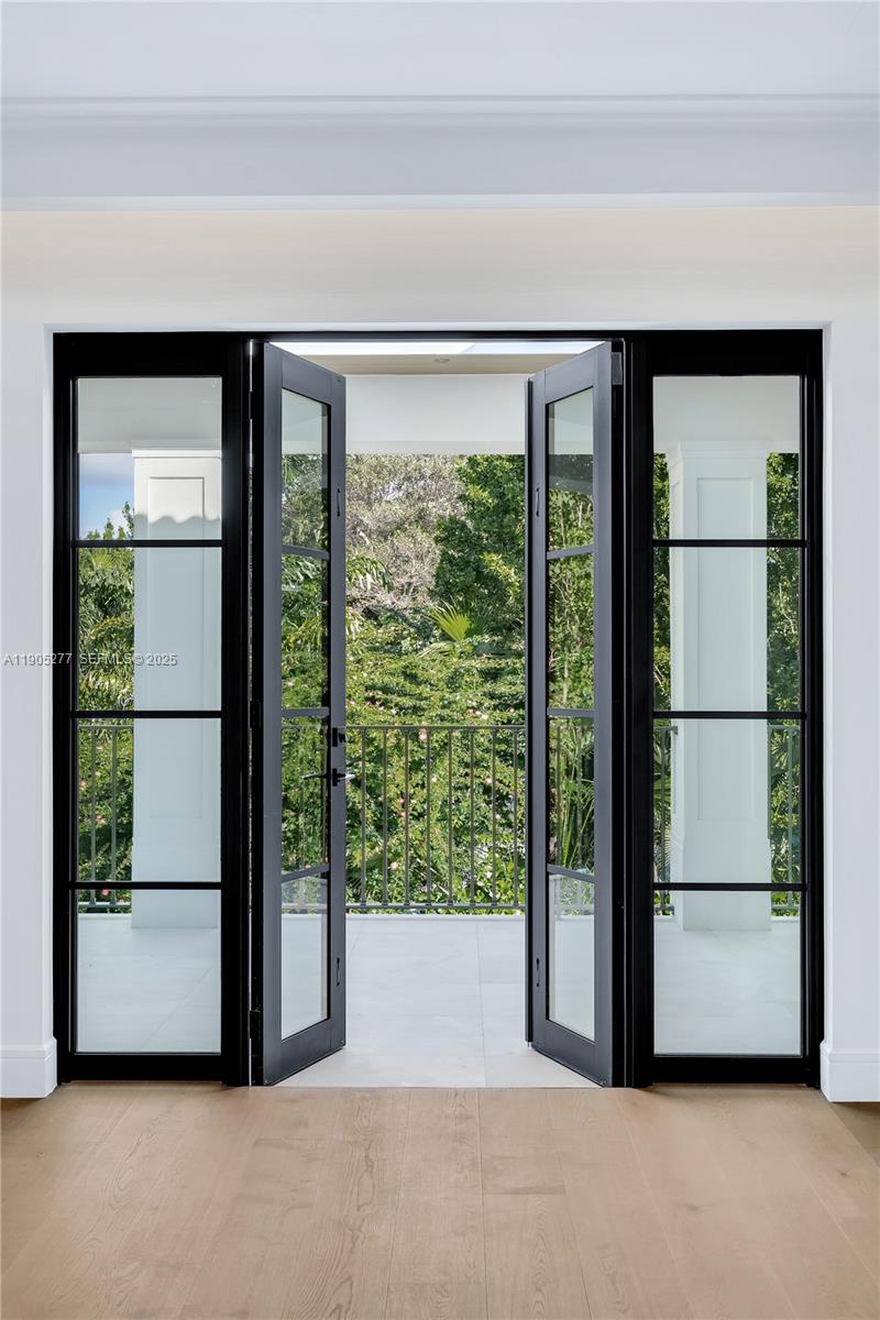 4191 Battersea Road Miami, FL 33133 - Photo 10 of 27 a view of an empty room with a window