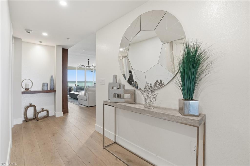 13945 Old Coast Road, Unit 1906 Naples, FL 34110 - Photo 23 of 40 a view of living room with furniture and potted plant