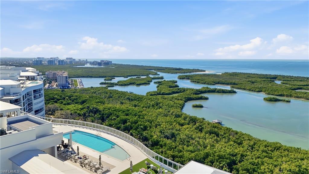 13945 Old Coast Road, Unit 1906 Naples, FL 34110 - Photo 34 of 40 a view of a lake with a city