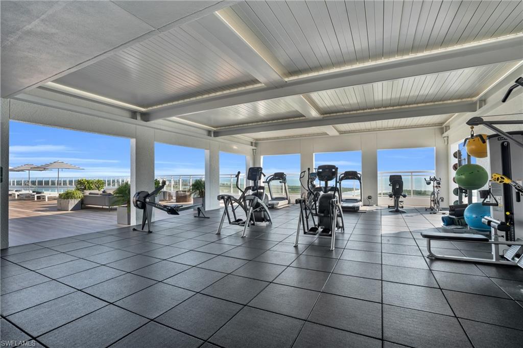 13945 Old Coast Road, Unit 1906 Naples, FL 34110 - Photo 36 of 40 a group of people sitting in a room