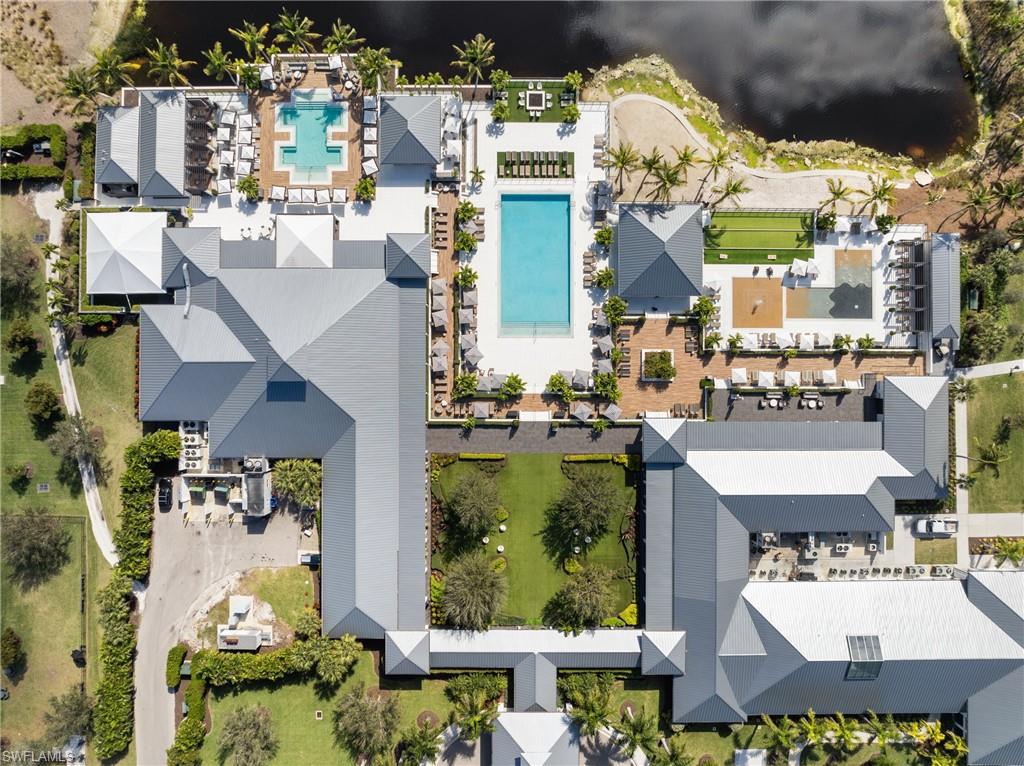 13945 Old Coast Road, Unit 1906 Naples, FL 34110 - Photo 38 of 40 an aerial view of residential houses with outdoor space