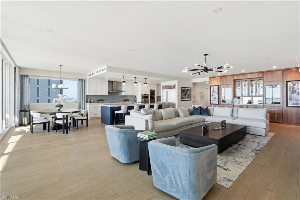 13945 Old Coast Road, Unit 1906 Naples, FL 34110 - Photo 5 of 40 a living room with furniture and a view of kitchen