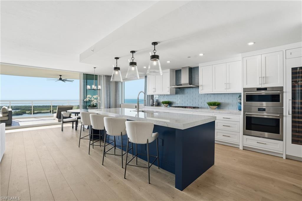 13945 Old Coast Road, Unit 1906 Naples, FL 34110 - Photo 7 of 40 a kitchen with a sink and counter top space