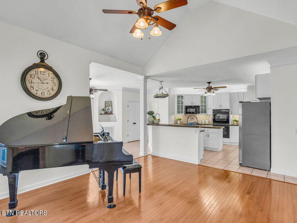 7425 Lawford Road Knoxville, TN 37919 - Photo 14 of 57 a living room with stainless steel appliances kitchen island a table and chairs