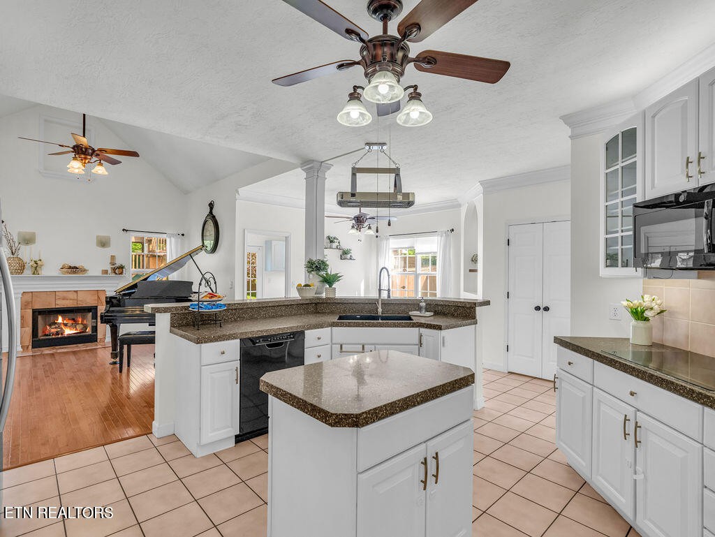 7425 Lawford Road Knoxville, TN 37919 - Photo 16 of 57 a kitchen with a stove sink and cabinets