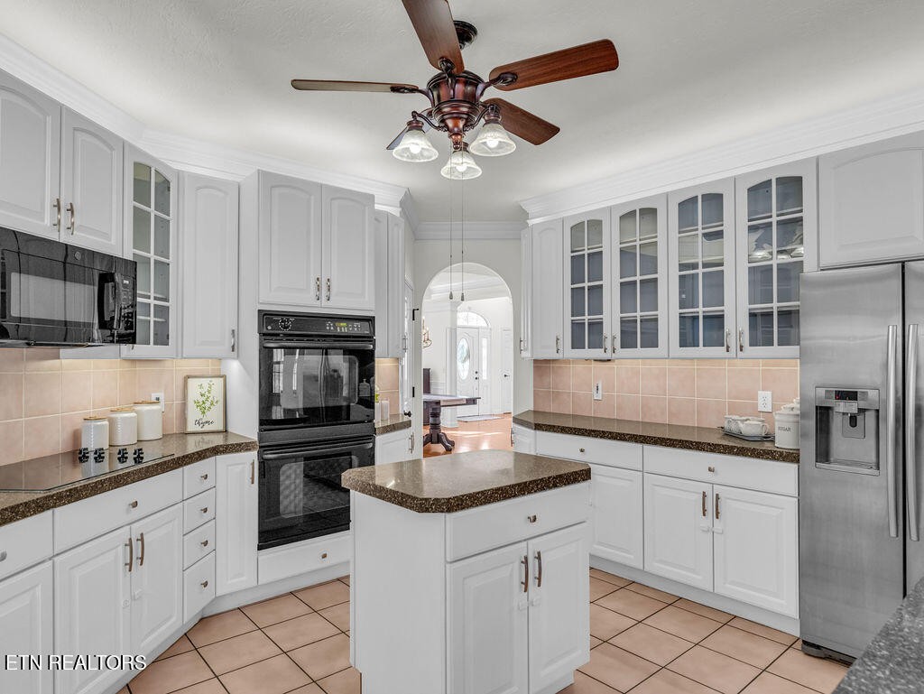 7425 Lawford Road Knoxville, TN 37919 - Photo 22 of 57 a kitchen with granite countertop a sink stainless steel appliances and cabinets