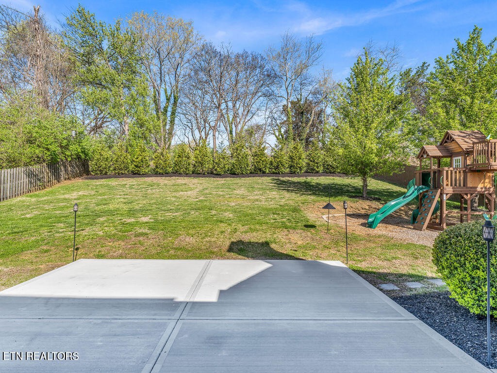 7425 Lawford Road Knoxville, TN 37919 - Photo 25 of 57 a view of a swimming pool with an outdoor seating and a yard