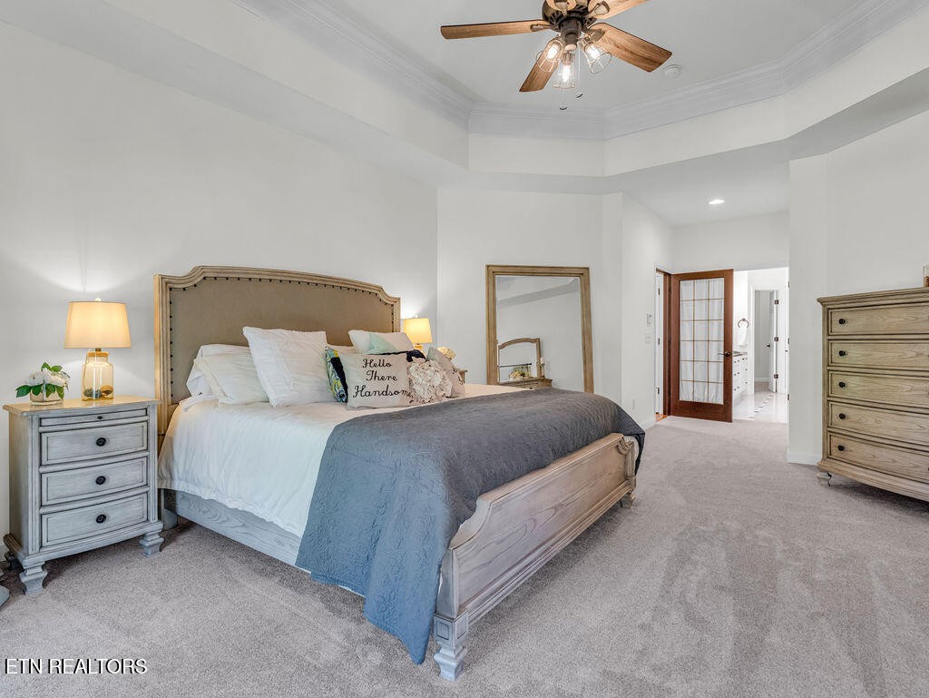 7425 Lawford Road Knoxville, TN 37919 - Photo 27 of 57 a spacious bedroom with a bed and a ceiling fan