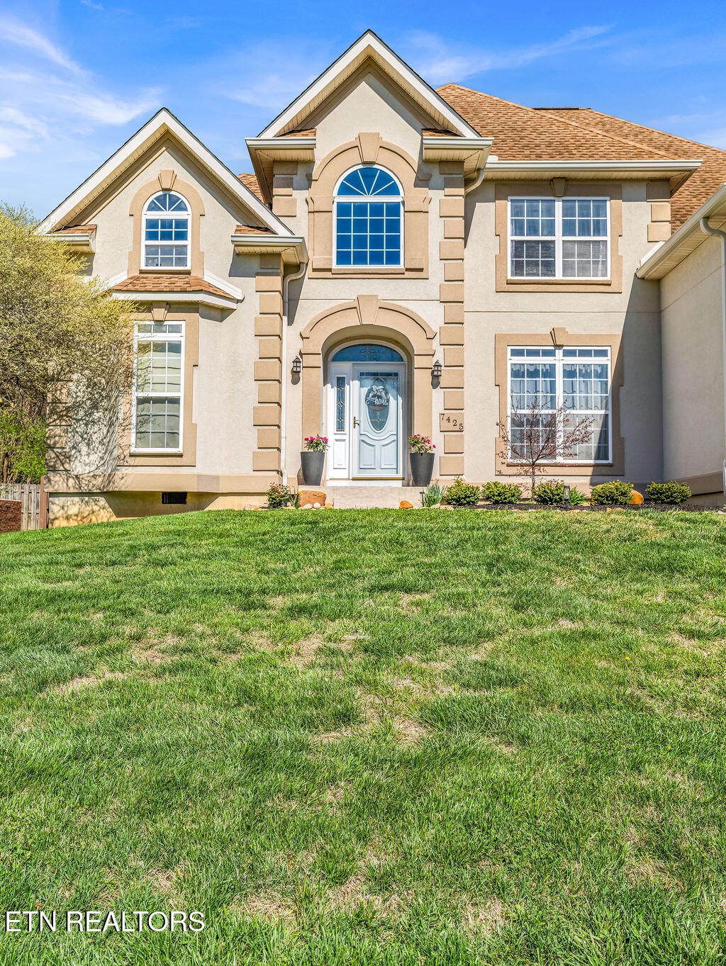 7425 Lawford Road Knoxville, TN 37919 - Photo 3 of 57 a front view of a house with a yard