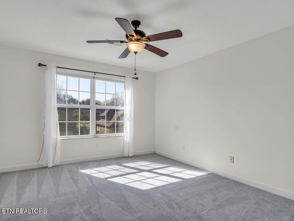 7425 Lawford Road Knoxville, TN 37919 - Photo 33 of 57 a view of wooden floor and a chandelier fan in a room