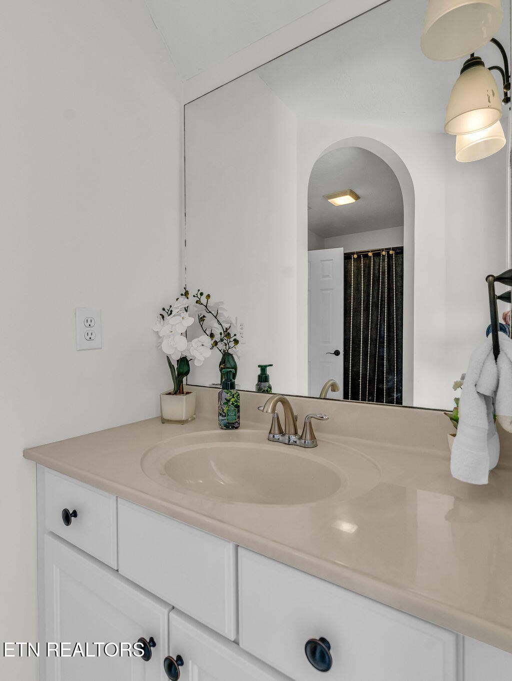 7425 Lawford Road Knoxville, TN 37919 - Photo 35 of 57 a bathroom with a sink and a mirror