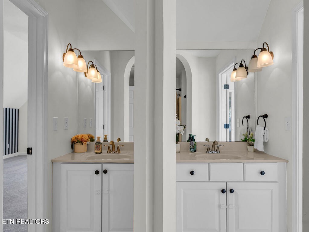 7425 Lawford Road Knoxville, TN 37919 - Photo 36 of 57 a bathroom with a sink and a mirror