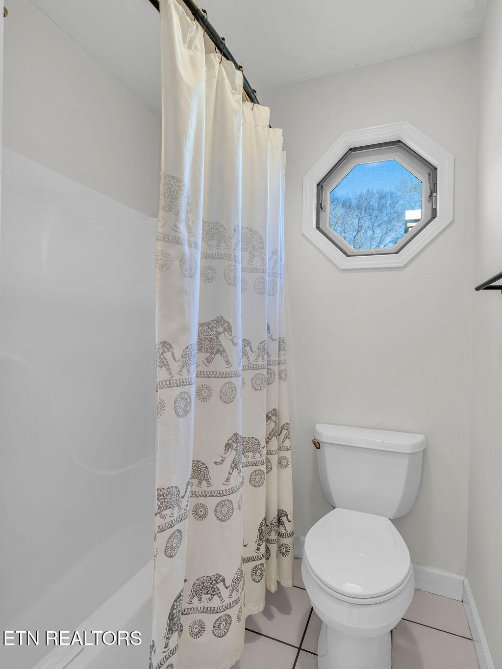 7425 Lawford Road Knoxville, TN 37919 - Photo 43 of 57 a white toilet sitting next to a shower curtain