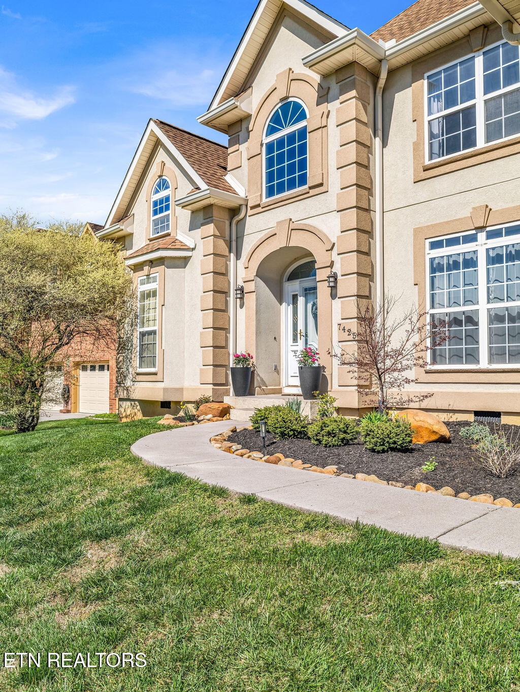 7425 Lawford Road Knoxville, TN 37919 - Photo 48 of 57 a front view of a house with garden