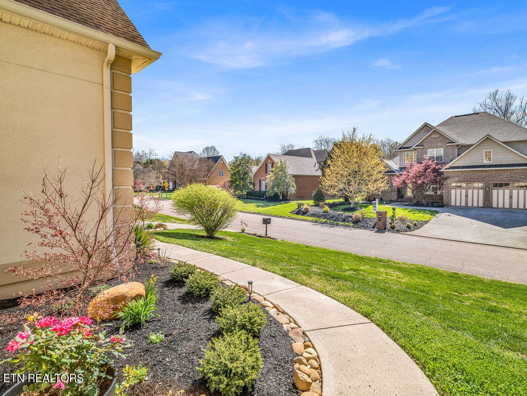 7425 Lawford Road Knoxville, TN 37919 - Photo 49 of 57 a view of a house with a yard and potted plants