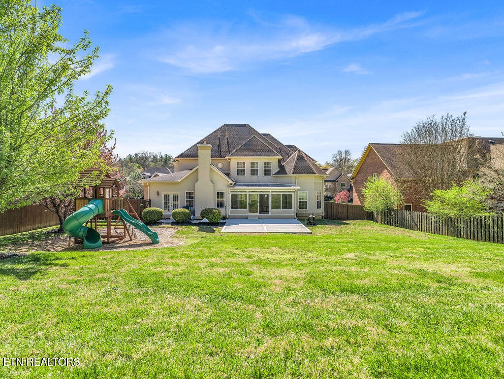 7425 Lawford Road Knoxville, TN 37919 - Photo 55 of 57 a view of a house with a big yard and potted plants