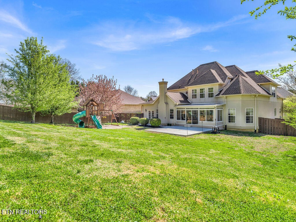 7425 Lawford Road Knoxville, TN 37919 - Photo 56 of 57 a front view of a house with a garden