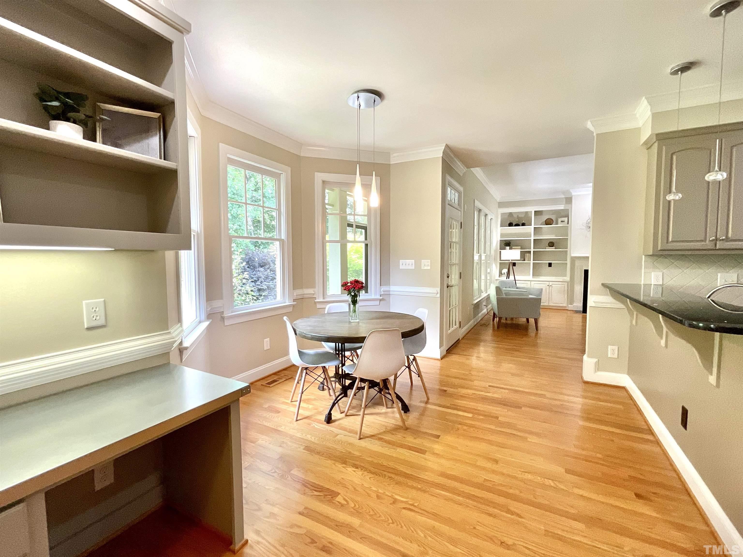 4300 Dula Street Durham, NC 27705 - Photo 20 of 42 a view of a dining room with furniture and wooden floor