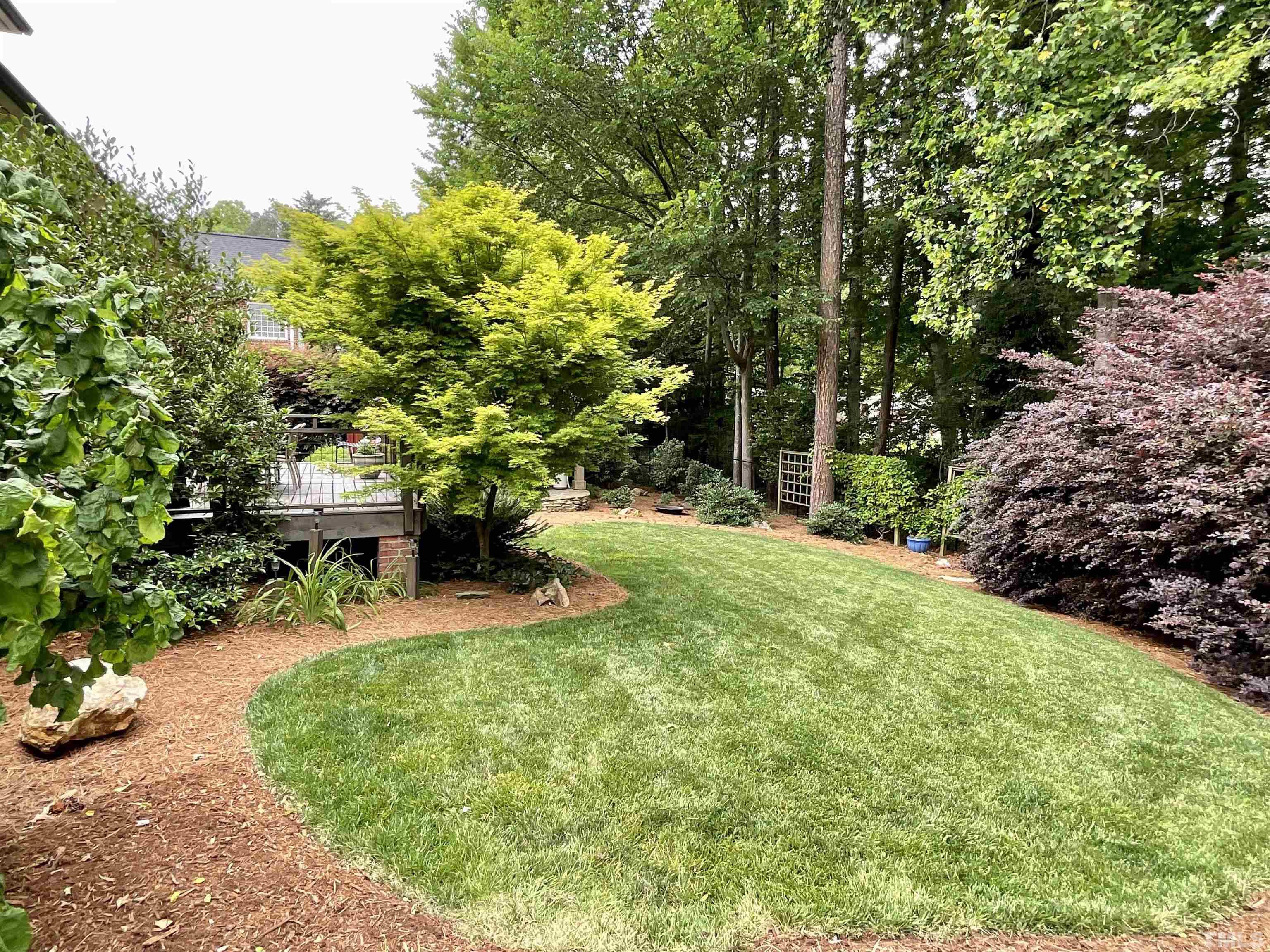 4300 Dula Street Durham, NC 27705 - Photo 37 of 42 a view of a backyard with plants and a patio