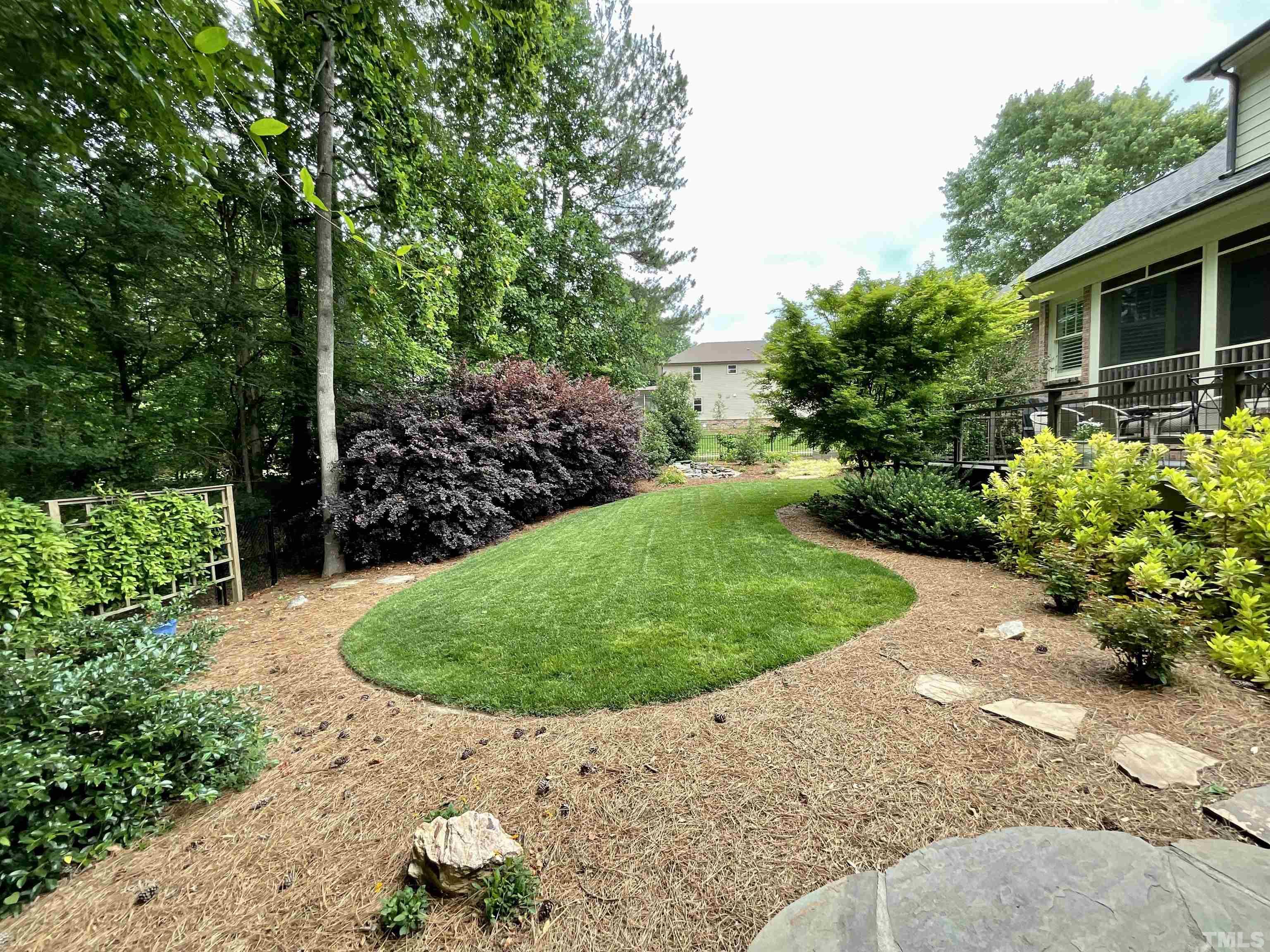4300 Dula Street Durham, NC 27705 - Photo 41 of 42 a view of a backyard with plants and a garden