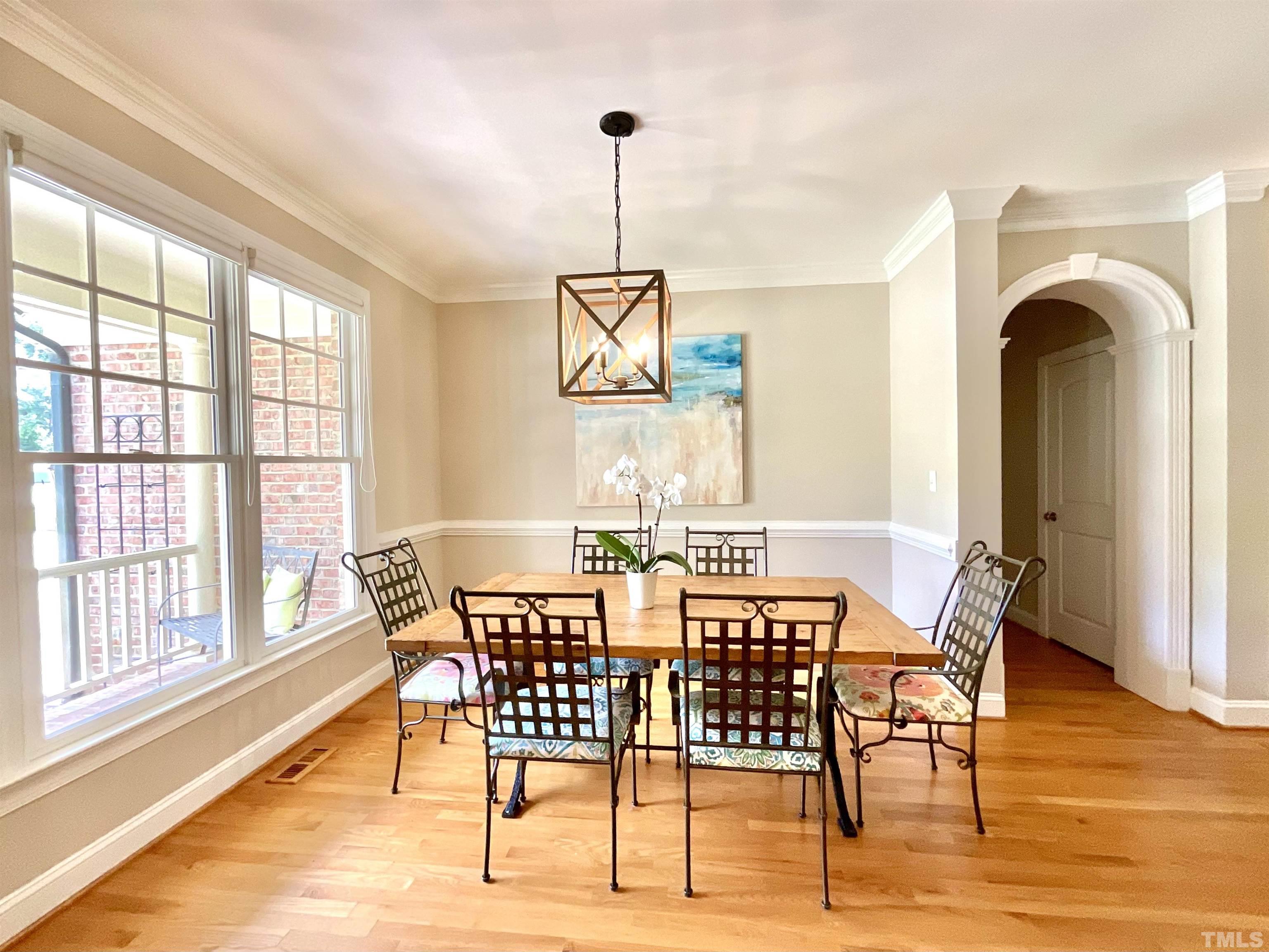 4300 Dula Street Durham, NC 27705 - Photo 10 of 42 a view of a dining room with furniture window and wooden floor