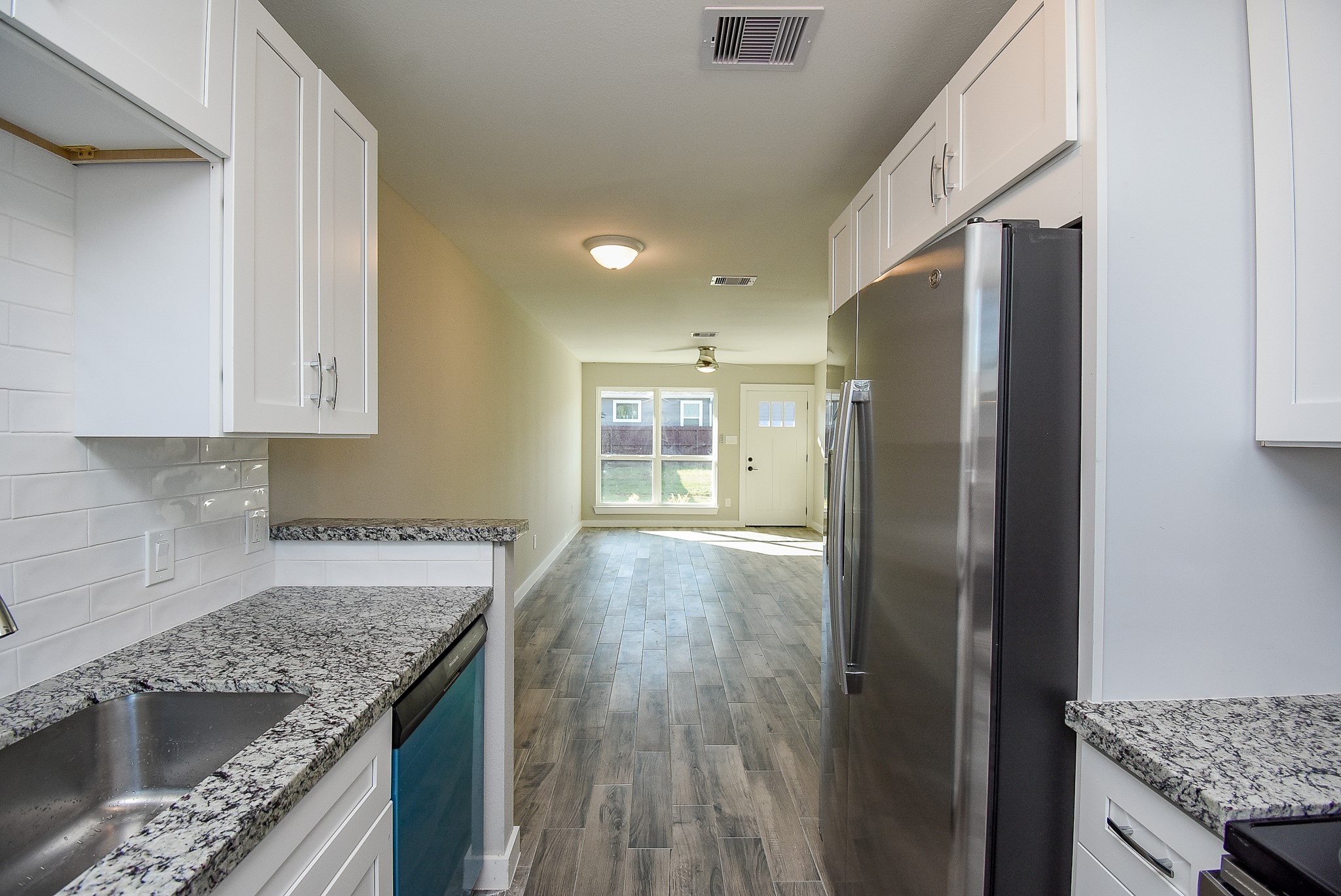 6522 De Priest Street, Unit B Houston, TX 77091 - Photo 11 of 22 View of kitchen to living area