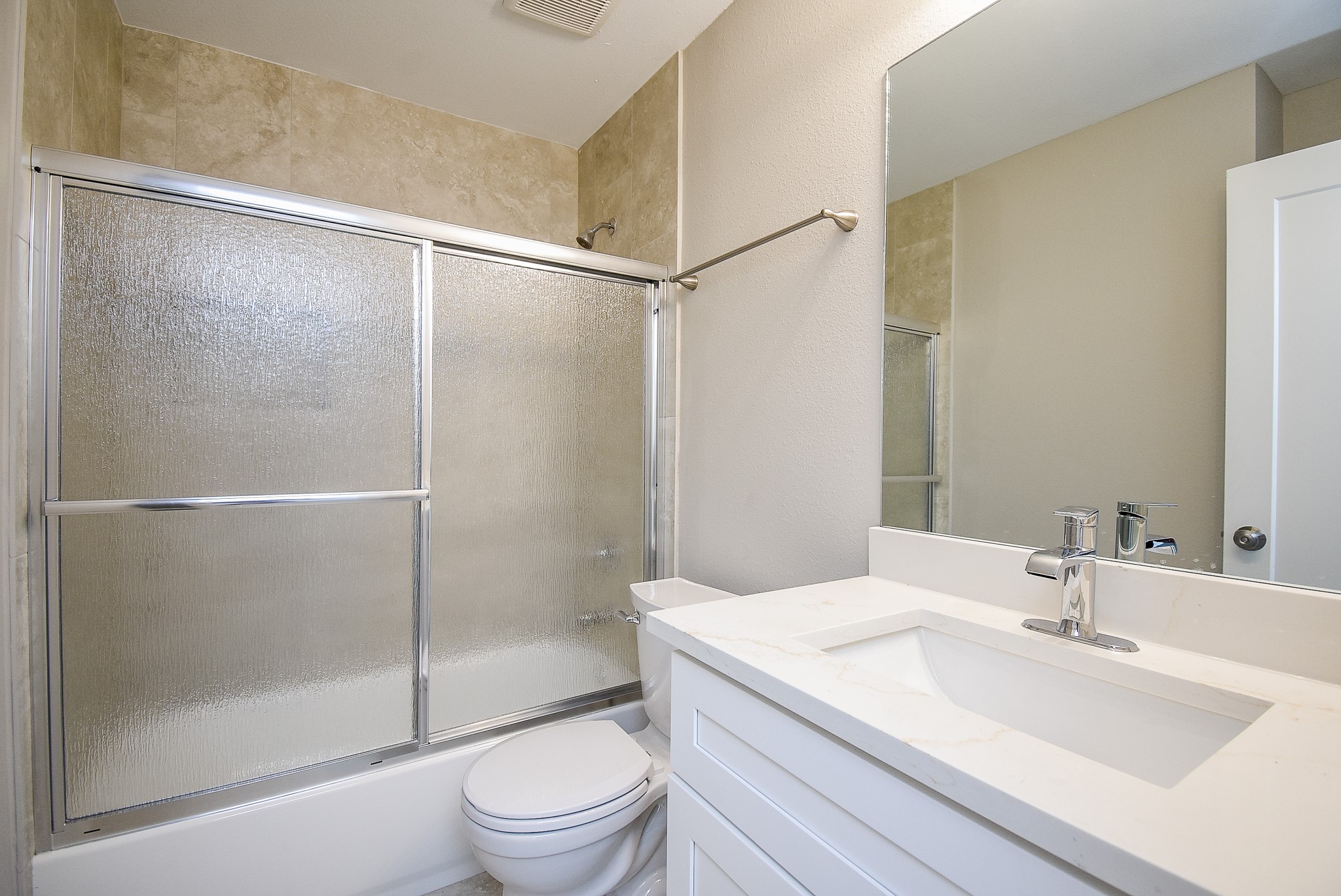 6522 De Priest Street, Unit B Houston, TX 77091 - Photo 19 of 22 Bathroom with quartz countertop and mirror