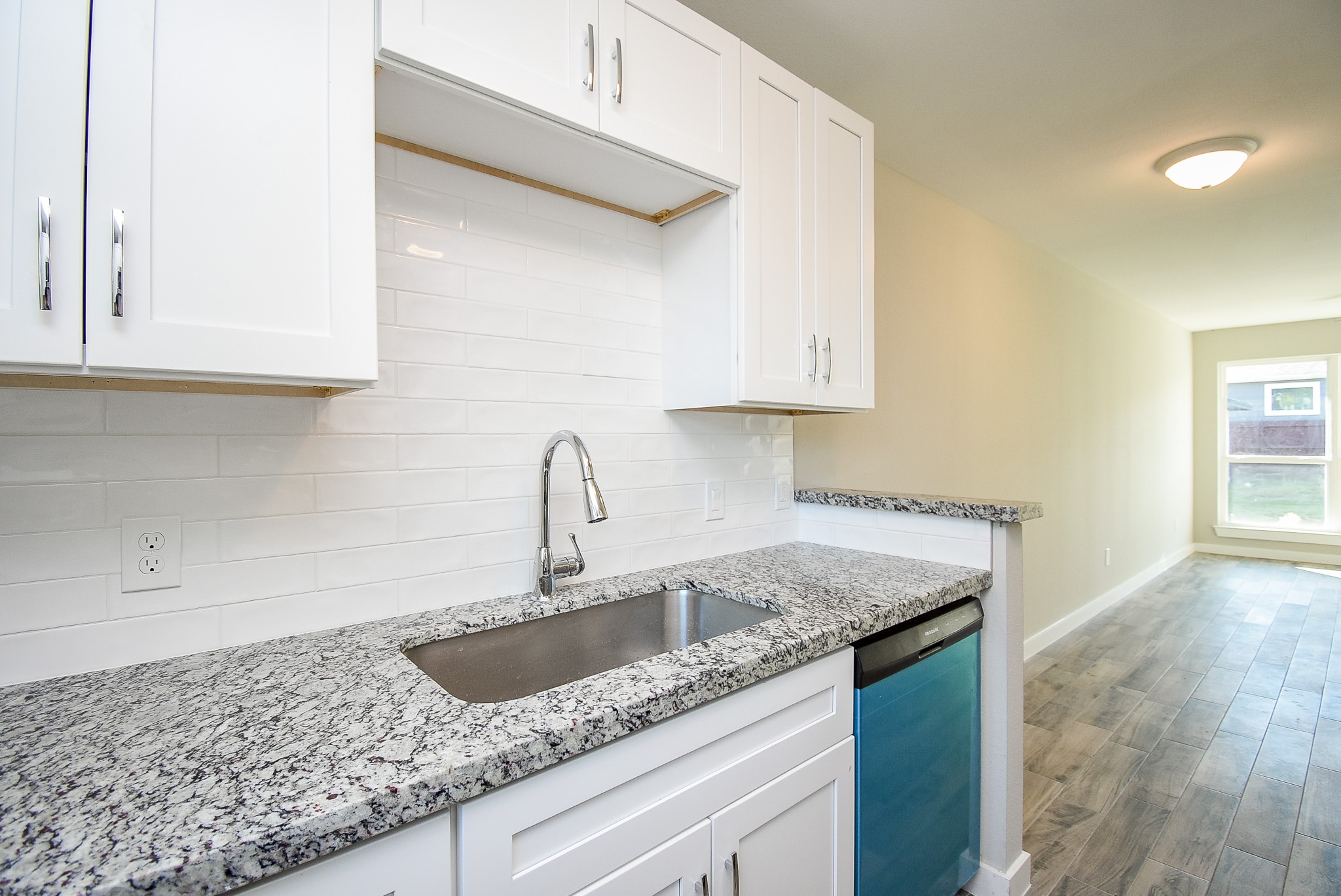 6522 De Priest Street, Unit B Houston, TX 77091 - Photo 10 of 22 View of Kitchen sink and bar to breakfast area