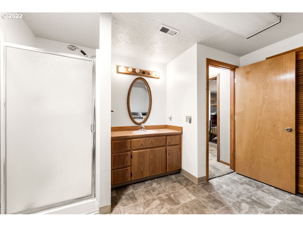 19111 Southeast Langensand Road Sandy, OR 97055 - Photo 23 of 31 a bathroom with a sink mirror vanity and toilet