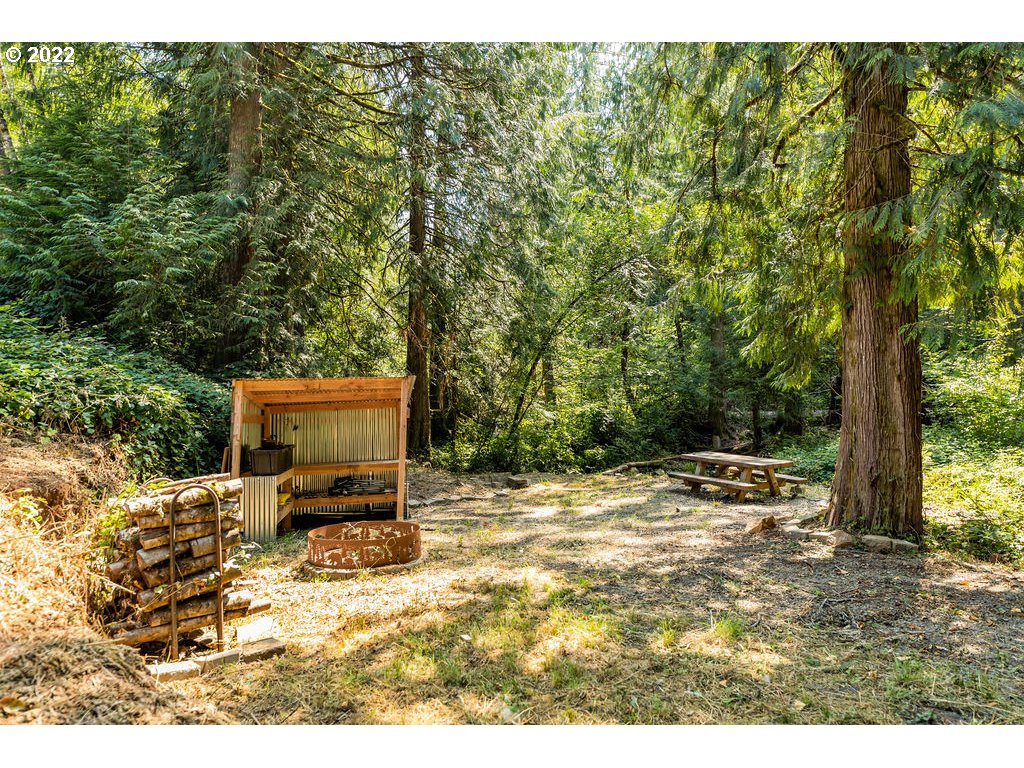 19111 Southeast Langensand Road Sandy, OR 97055 - Photo 31 of 31 a backyard of a house with table and chairs