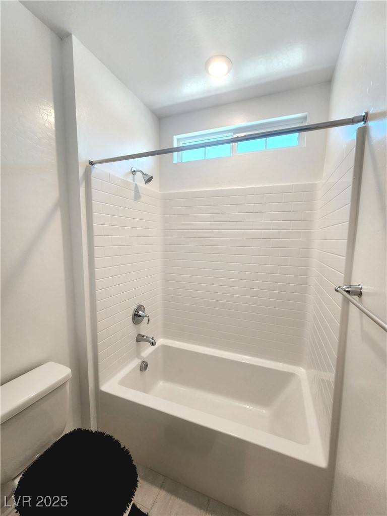 7308 North Decatur Boulevard, Unit 4 North Las Vegas, NV 89084 - Photo 15 of 34 Bathroom with shower / bath combination and tile patterned floors