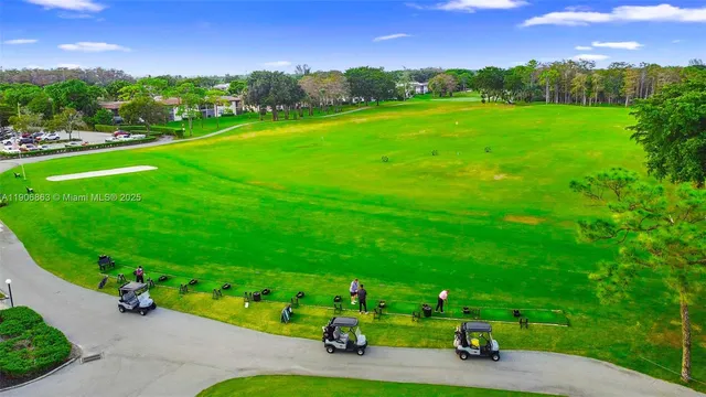 a view of a golf course with a house