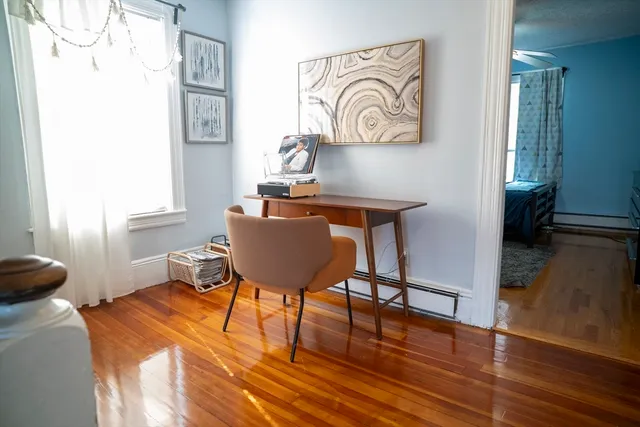 a workspace with furniture and a window
