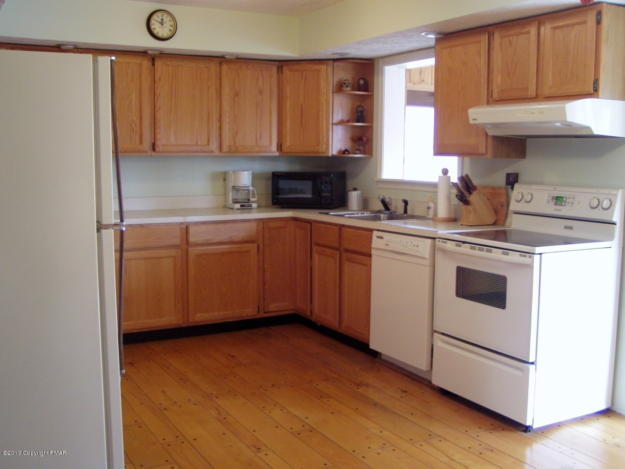 127 Mikes Road Bartonsville, PA 18321 - Photo 3 of 30 a kitchen with a sink cabinets and a window