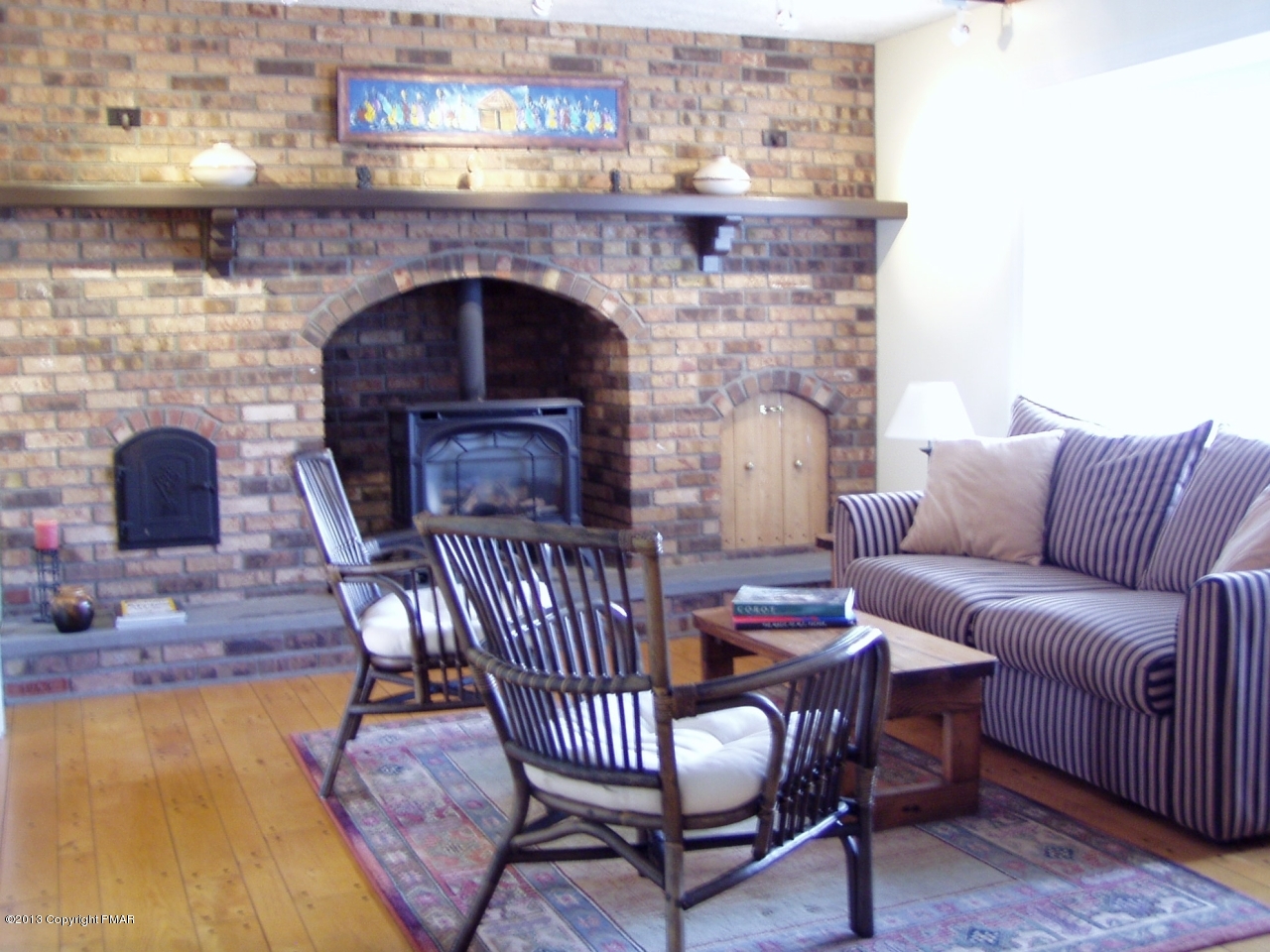 127 Mikes Road Bartonsville, PA 18321 - Photo 9 of 30 a living room with furniture and a fireplace
