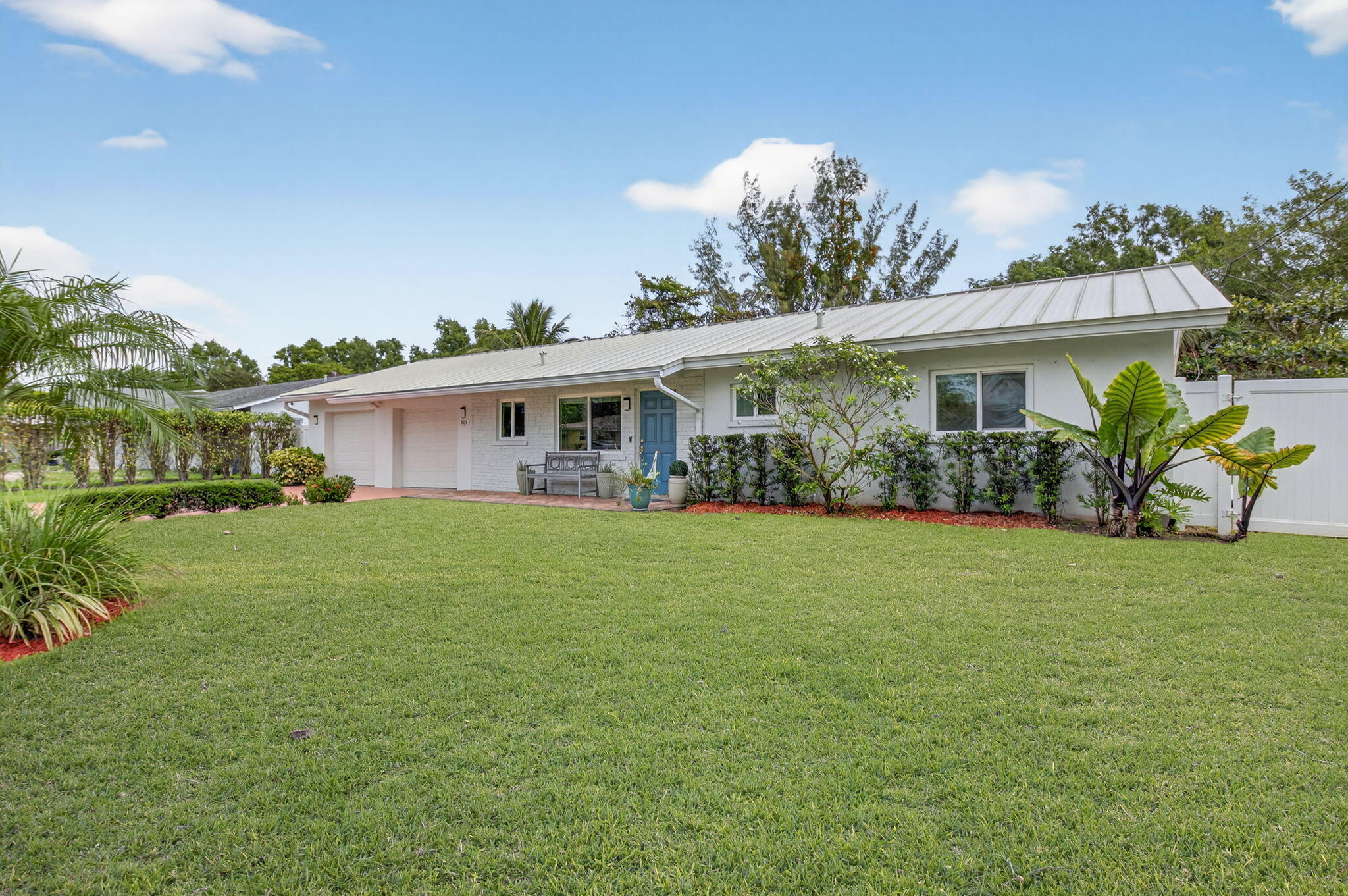 400 East Conference Drive Boca Raton, FL 33486 - Photo 2 of 41 a view of a house with a garden