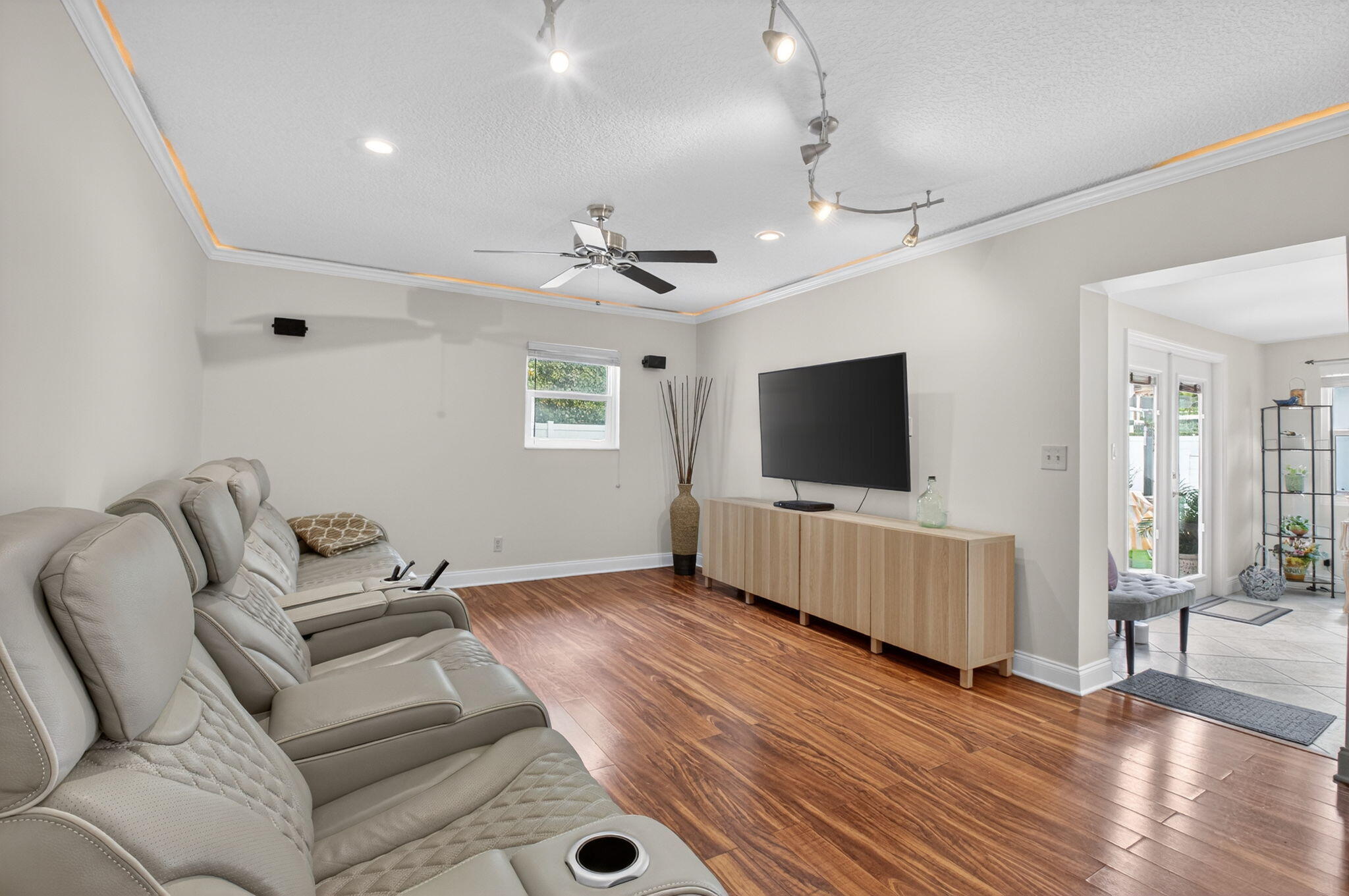 400 East Conference Drive Boca Raton, FL 33486 - Photo 22 of 41 a living room with furniture and a flat screen tv