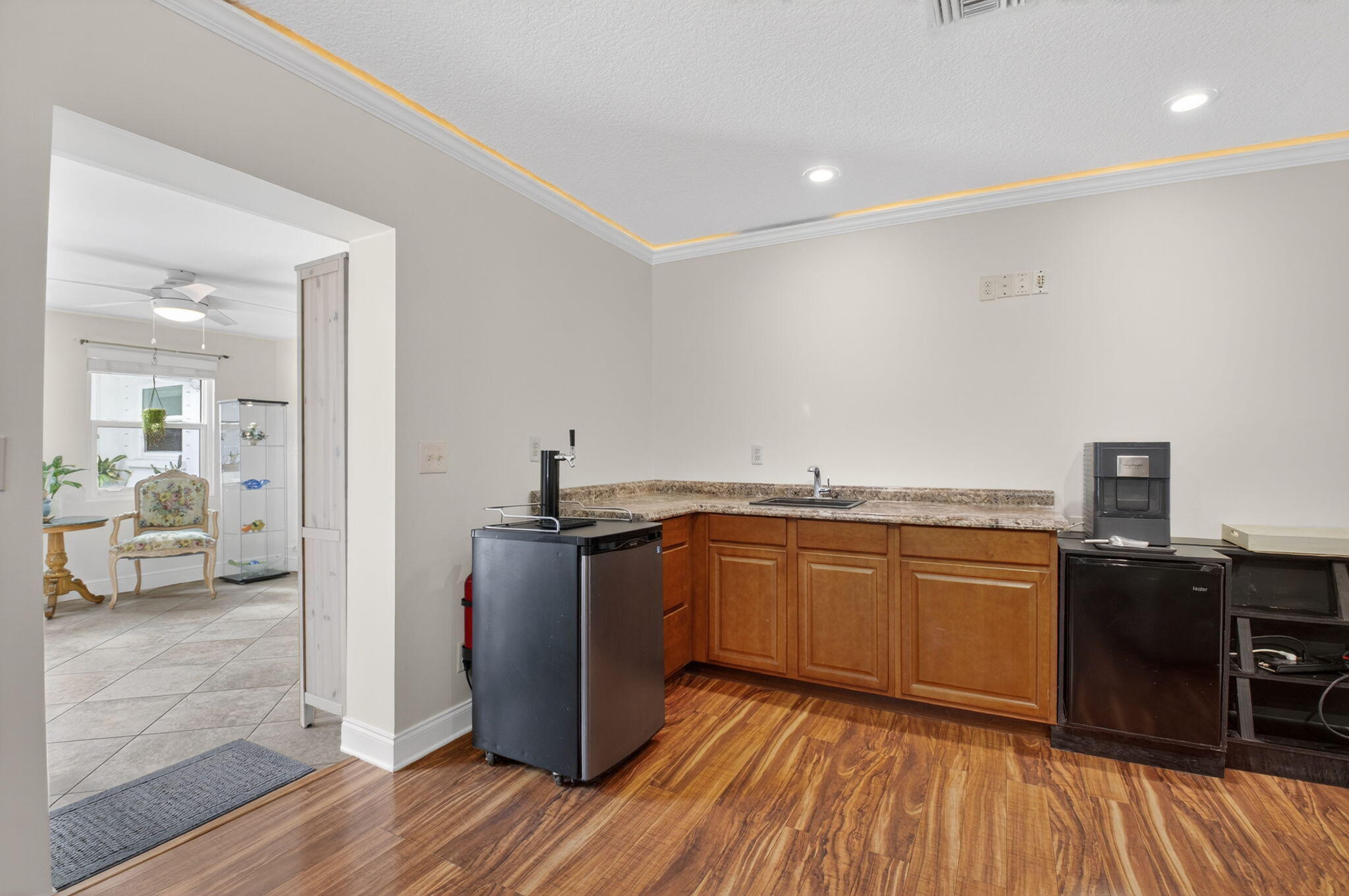 400 East Conference Drive Boca Raton, FL 33486 - Photo 23 of 41 a kitchen with stainless steel appliances granite countertop a refrigerator a stove top oven and wooden floors