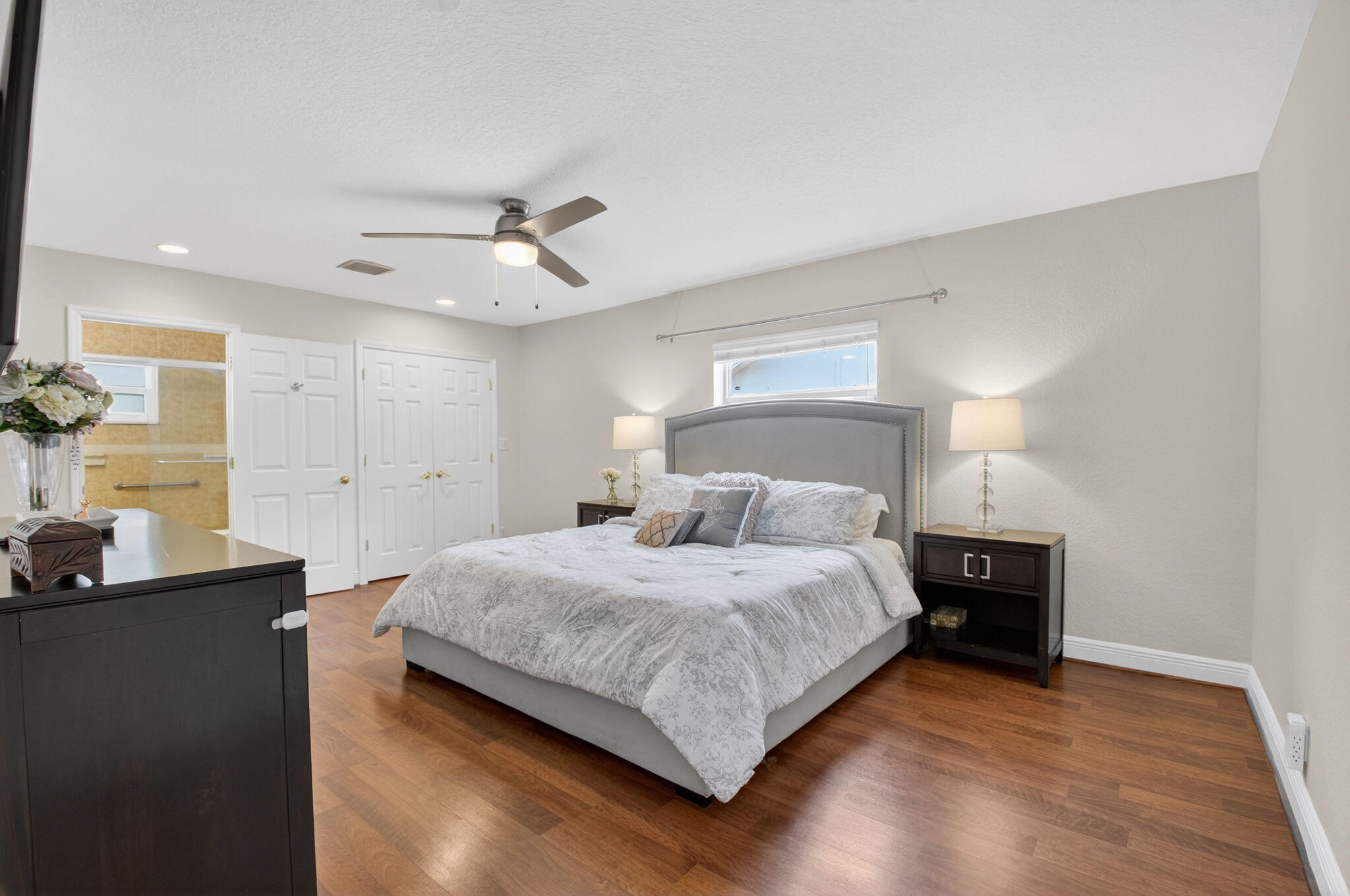 400 East Conference Drive Boca Raton, FL 33486 - Photo 24 of 41 a bedroom with a bed and a table