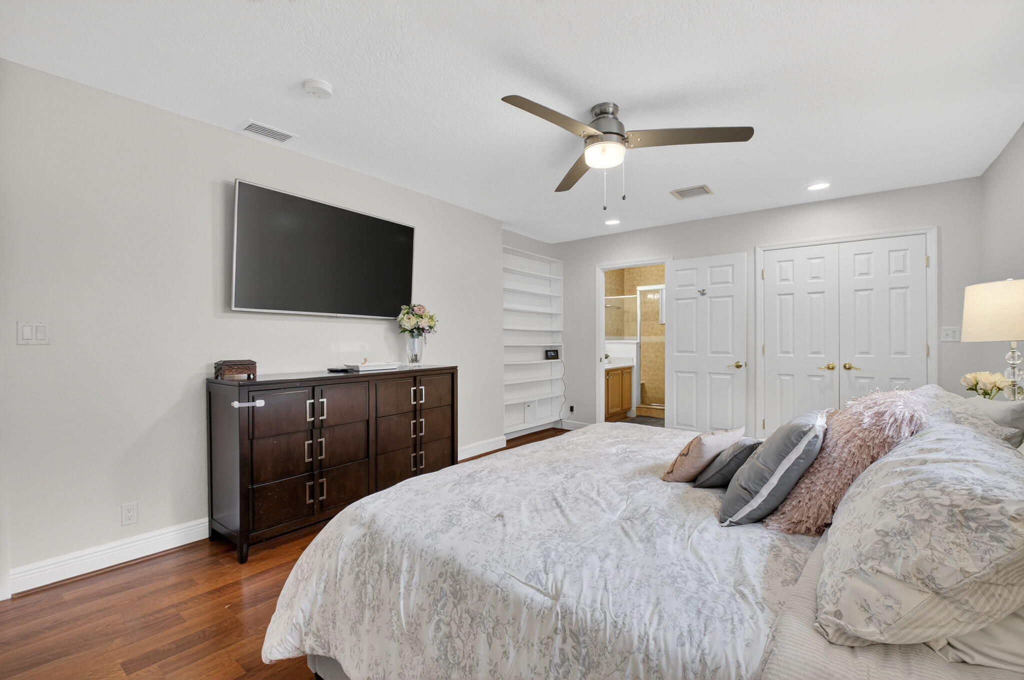 400 East Conference Drive Boca Raton, FL 33486 - Photo 25 of 41 a bedroom with a bed and a flat screen tv