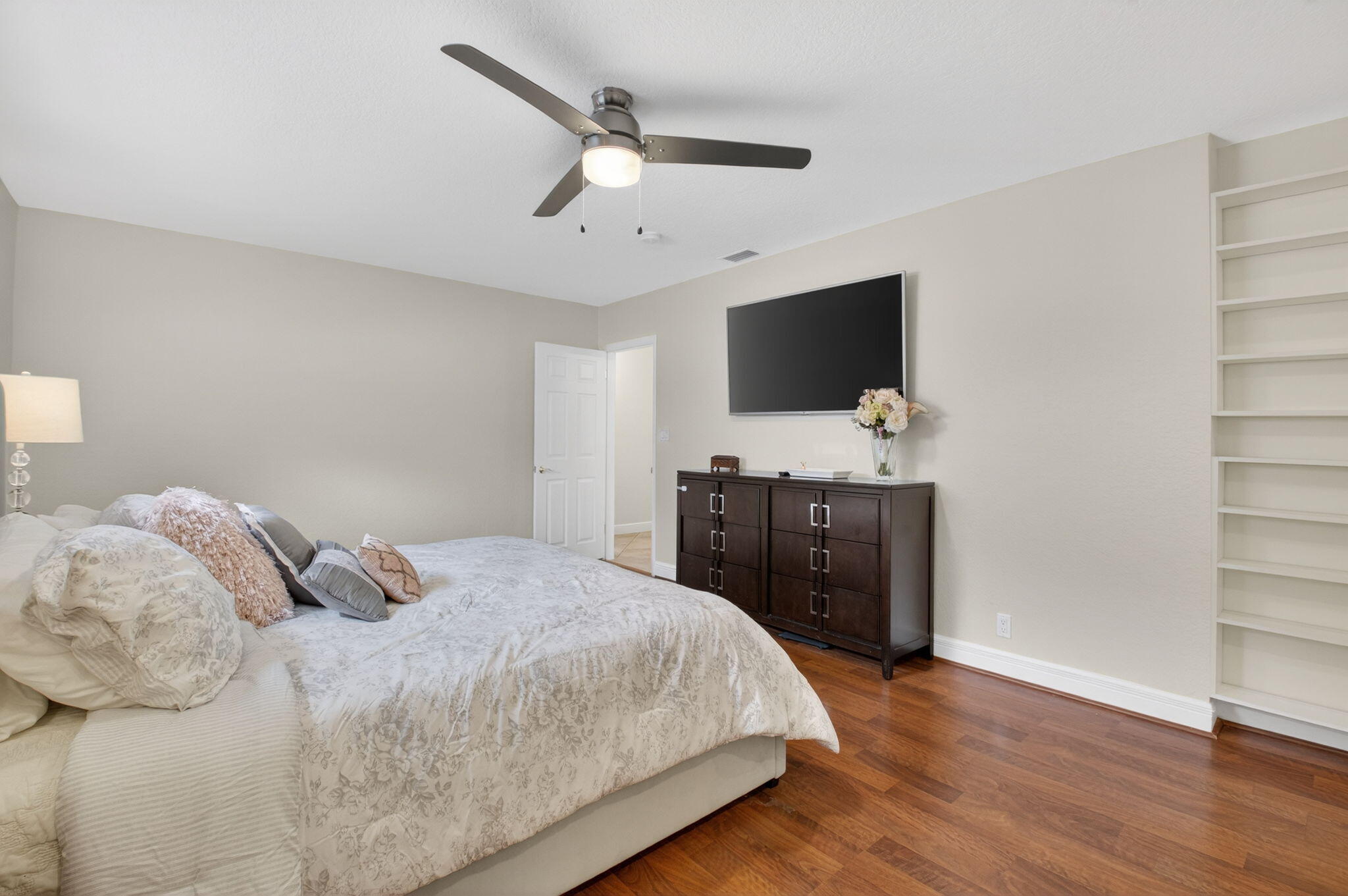 400 East Conference Drive Boca Raton, FL 33486 - Photo 26 of 41 a bedroom with a bed and a flat screen tv