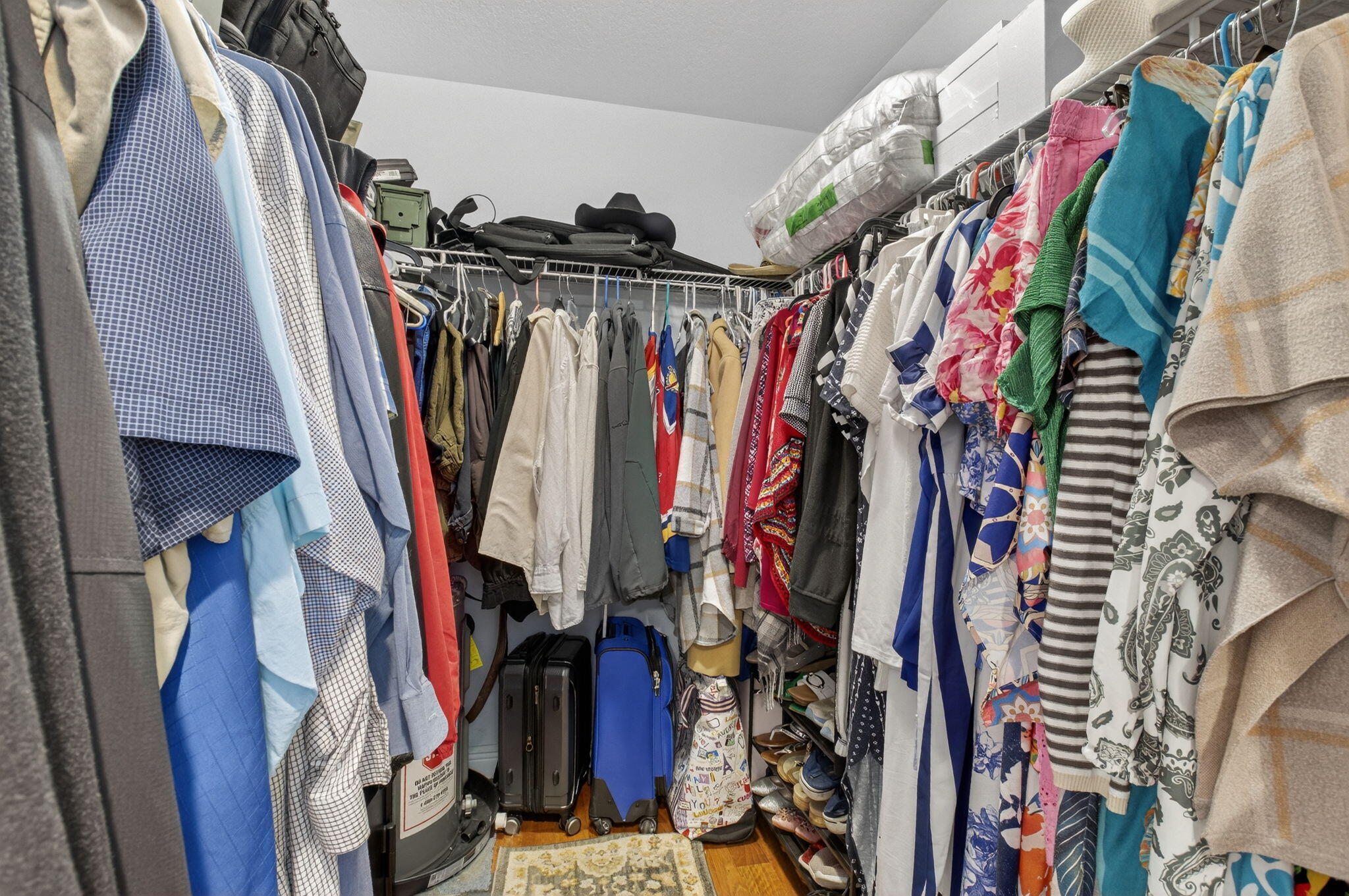 400 East Conference Drive Boca Raton, FL 33486 - Photo 27 of 41 a view of walk in closet with clothes