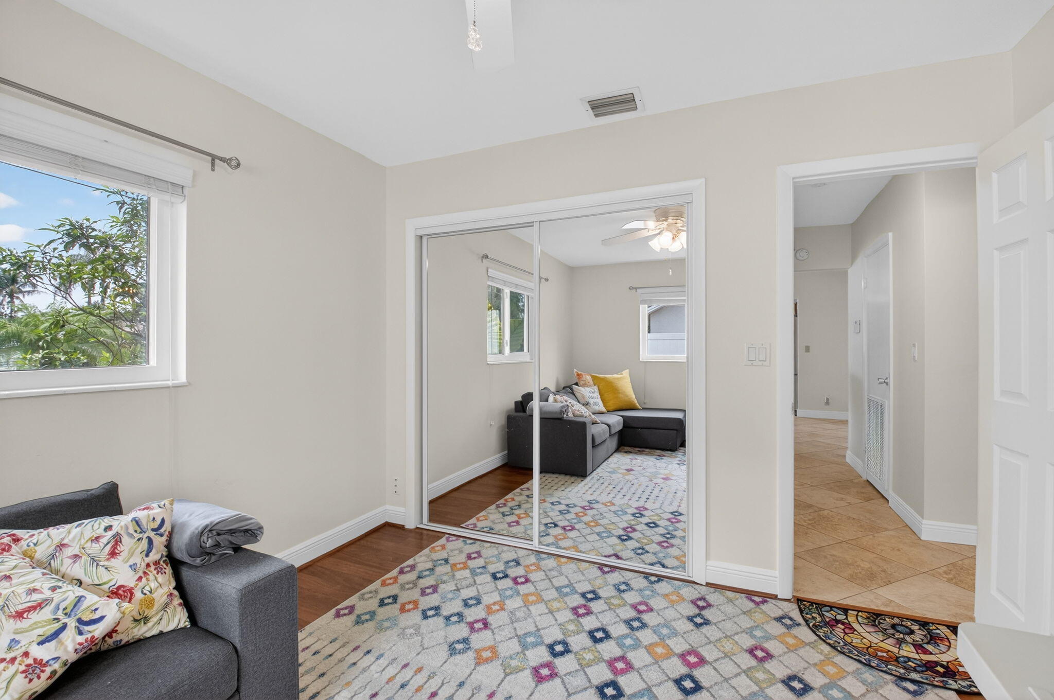 400 East Conference Drive Boca Raton, FL 33486 - Photo 30 of 41 a bedroom with a bed and wooden floor