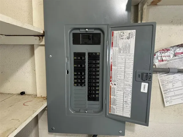 a bathroom with a granite countertop sink and a shower