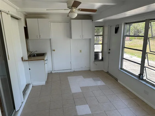 a view of a kitchen with a sink and a window