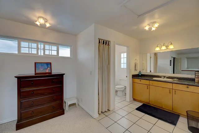 a room with mirror and a sink